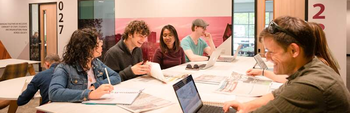 a group of PhD students in a classroom